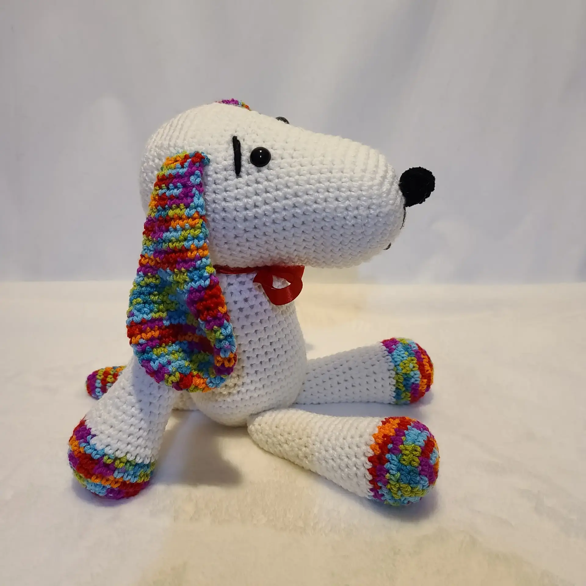White dog with colorful ears
